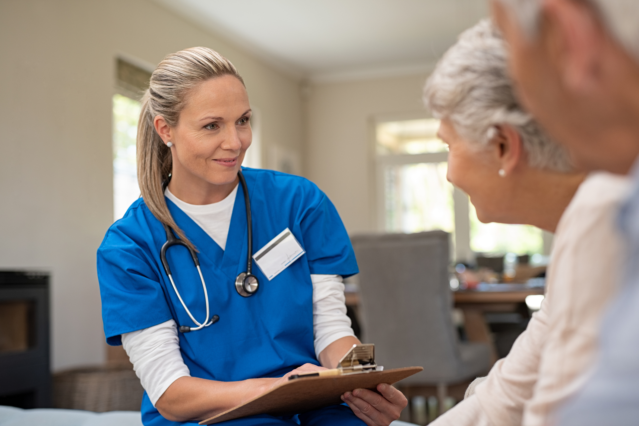 Medical professional assisting patient Medical professional assisting patient
